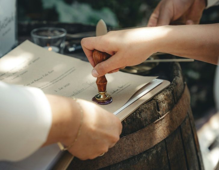 Person stamping official documents